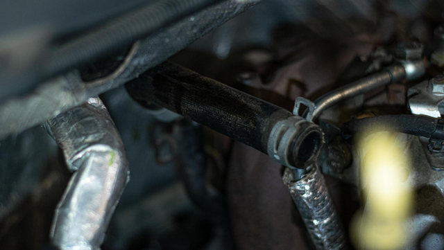 Remove the hard coolant pipe down the back of the block