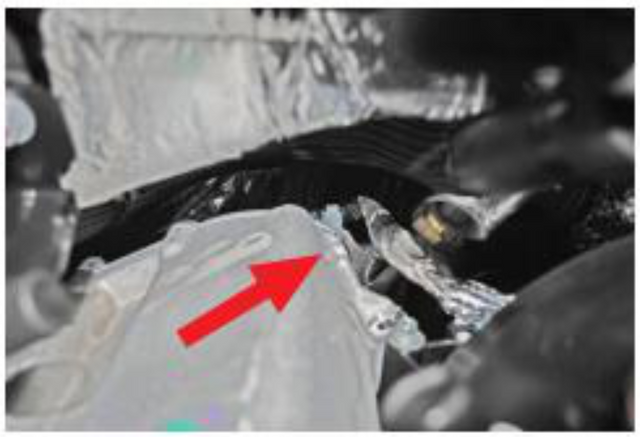 Remove the nut retaining the EBP hard line to the back of the cooler