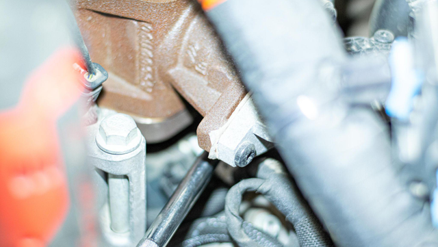 Unbolt the EGR cooler from the motor