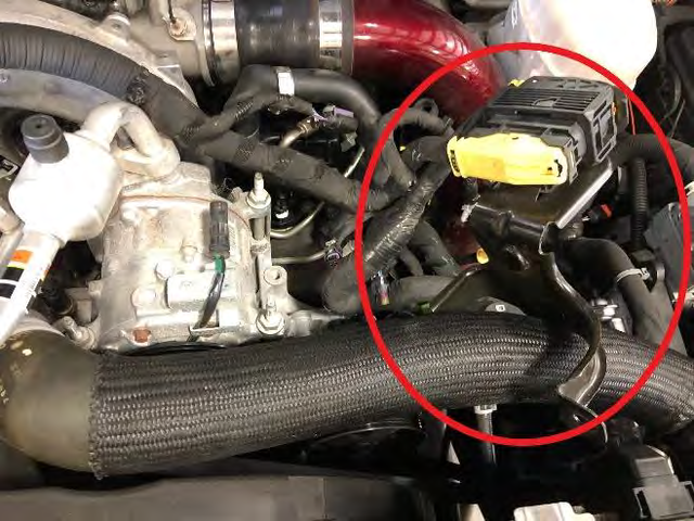 Unbolt the A/C compressor and slide it forward