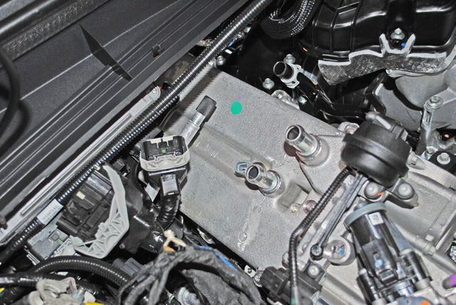 Remove the seven bolts that hold the EGR cooler in place