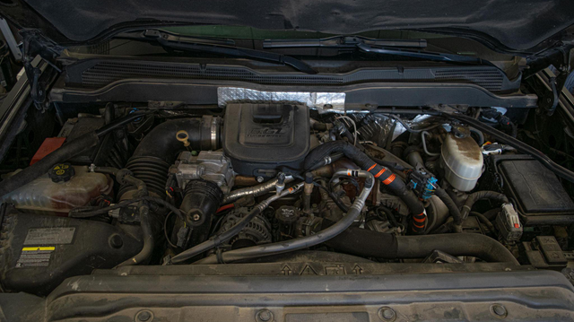 Let the engine cool, disconnect the battery and drain the coolant