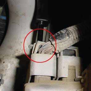 Unbolt the blue plug