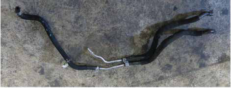 Disconnect the urea injector lines and remove their hose assembly