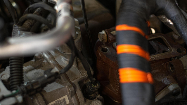 Unbolt the EGR cooler from the motor