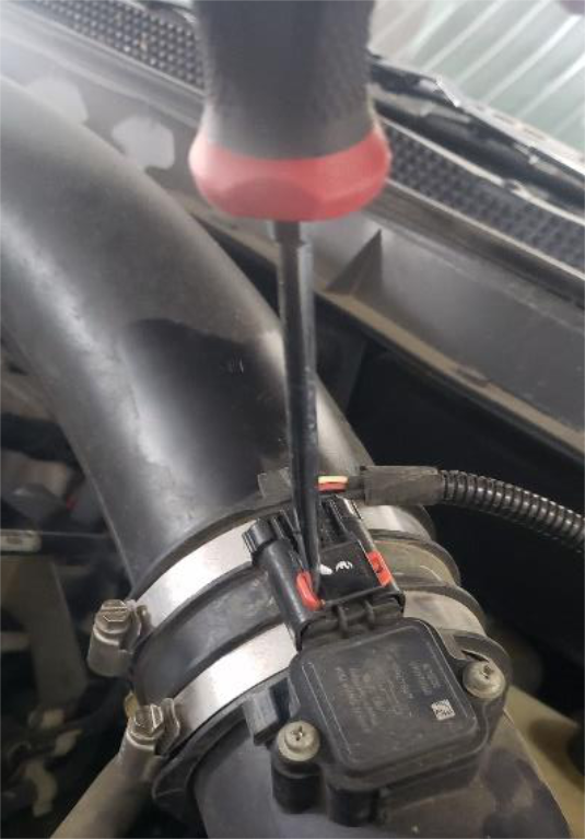 Unplug the MAF connector on the intake hose
