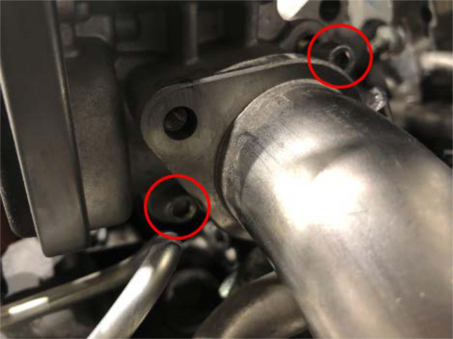Unbolt the EGR pipe and throttle body from the intake elbow