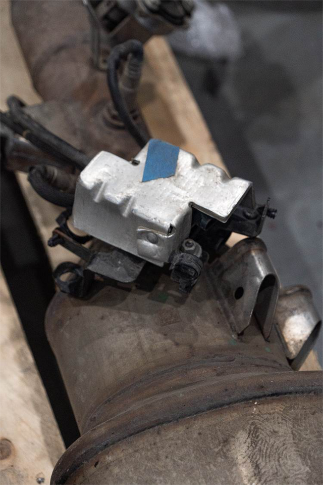 Unplug the NOx sensor module and remove it with the exhaust
