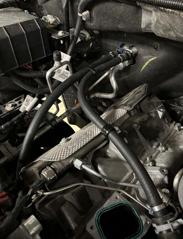 Quick-connect the upper end to the heater core fitting