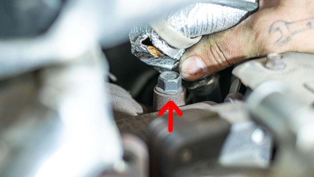 Remove the up-pipe to EGR cooler bolts