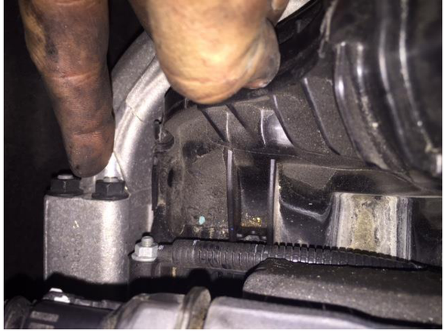 Remove the four nuts holding the EGR housing to the cylinder head