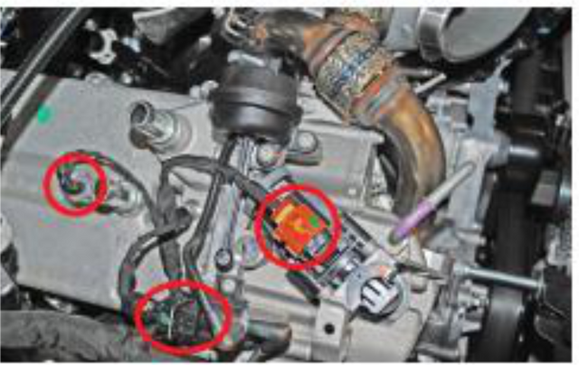 Unplug the harnesses on top of the EGR cooler and cap the vacuum line