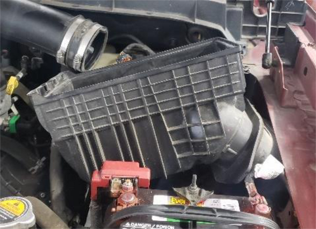 Cut the 2 zip ties and lift the air box out