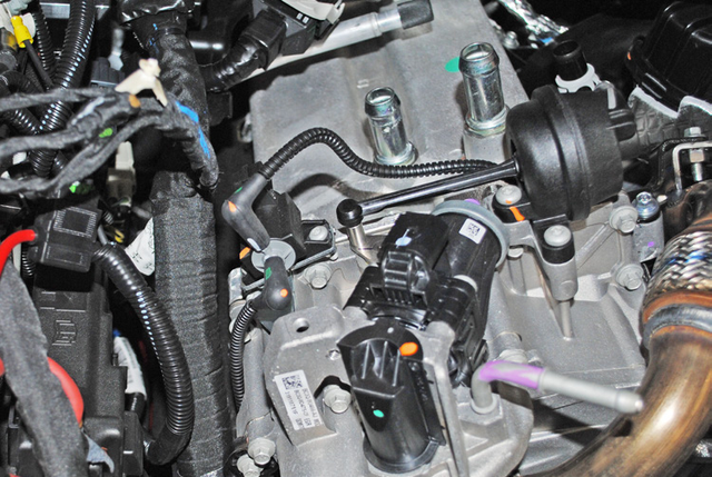 Unplug the harnesses on top of the EGR cooler and cap the vacuum line