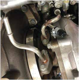 Cap the unused port on the turbo coolant supply line