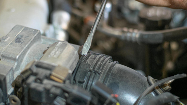 Remove the intake hose before the throttle valve