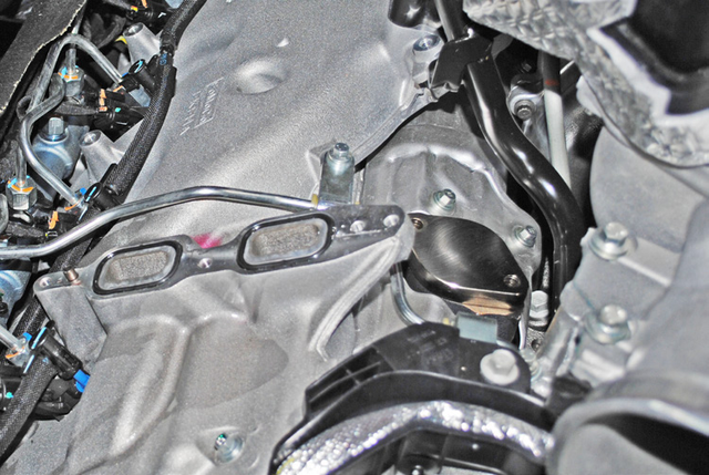 Install the exhaust manifold block off plate