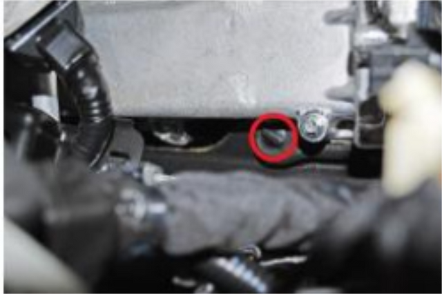 Remove the two clips on the heat shield