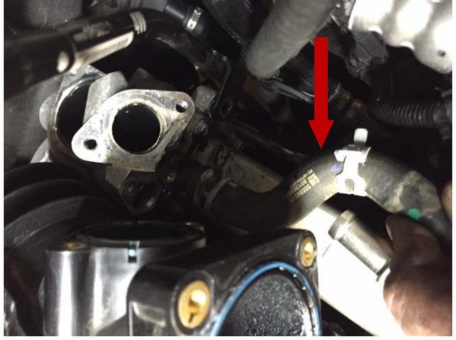 Remove the upper coolant hose from the EGR