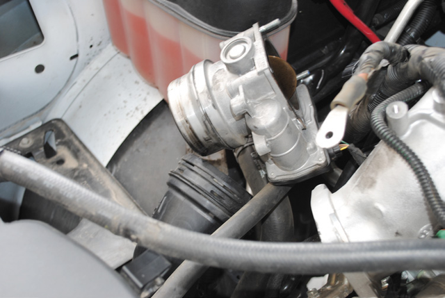 Remove the forward piece of the cast intercooler piping