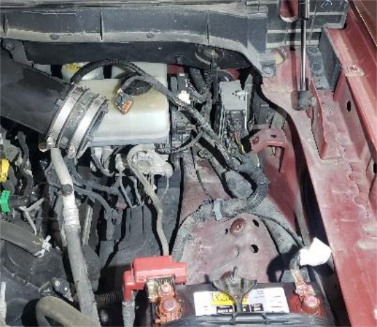 Cut the 2 zip ties and lift the air box out