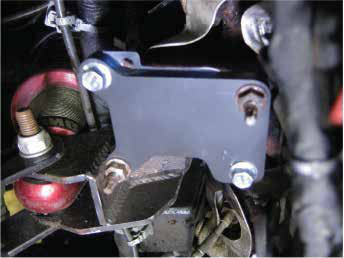 Install the steel manifold block off plate