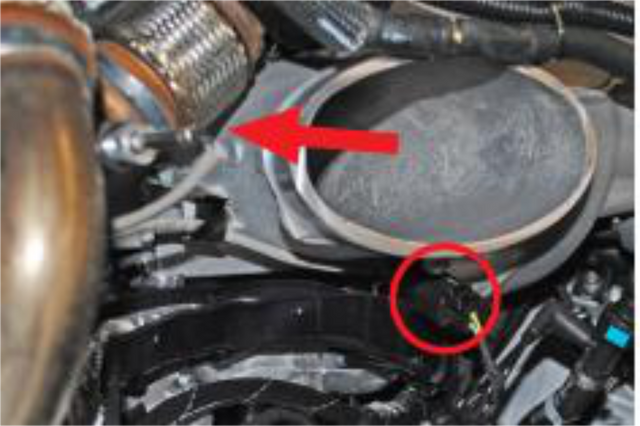 Disconnect the EGR temperature sensor and remove the short EGR pipe