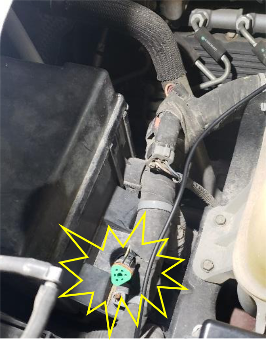 Connect the grey triangle connector behind the radiator overflow