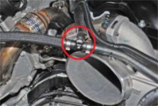 Disconnect the EGR temperature sensor and remove the short EGR pipe