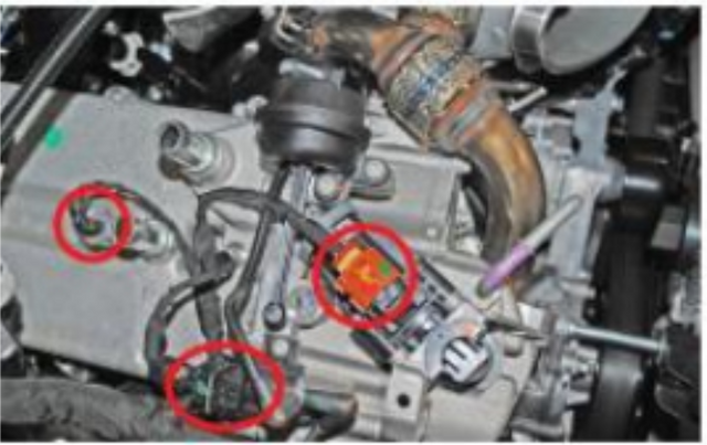 Unplug the harnesses on top of the EGR cooler and cap the vacuum line