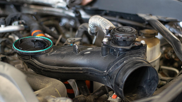 Release the hose clamp at the turbocharger inlet