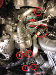 Remove the two large steel coolant pipes feeding the EGR cooler