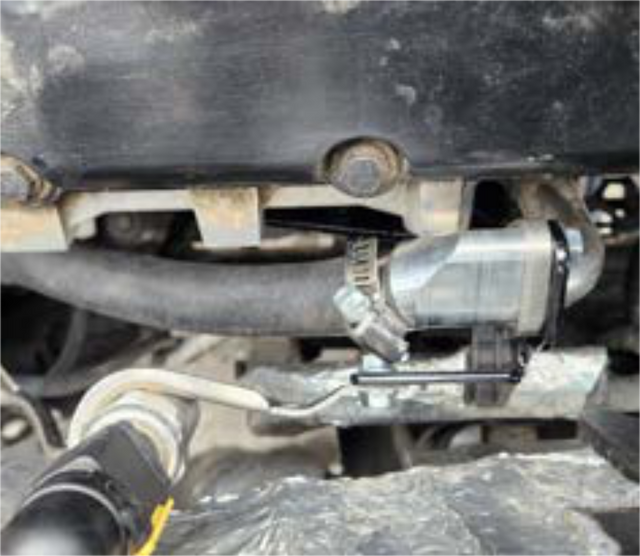Install the new bracket, standpipe and coolant adapter