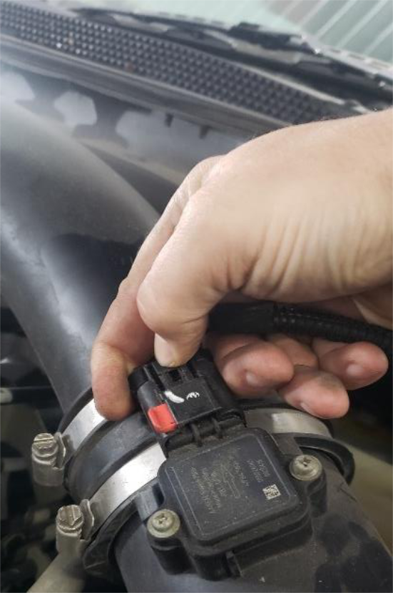 Unplug the MAF connector on the intake hose