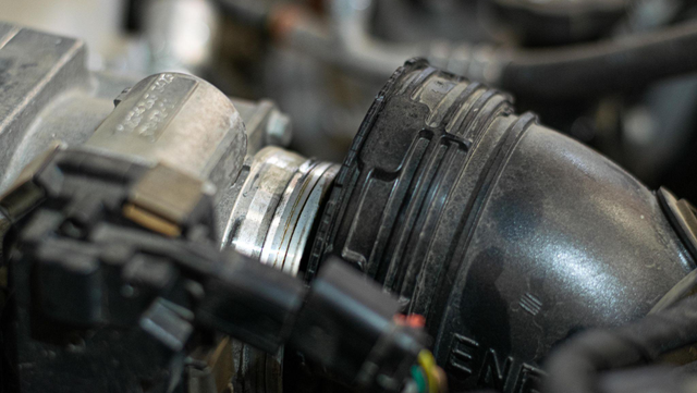 Remove the intake hose before the throttle valve