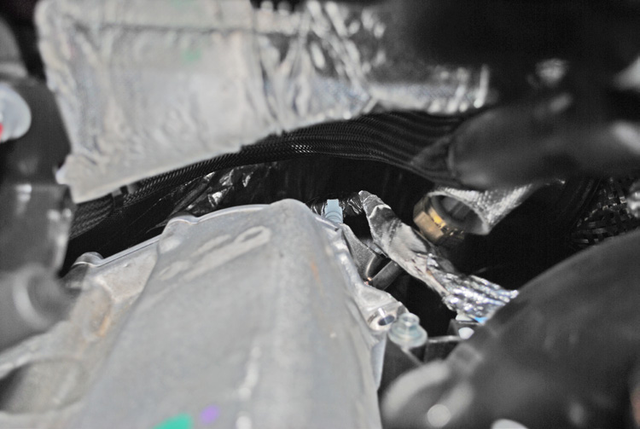 Remove the nut retaining the EBP hard line to the back of the cooler