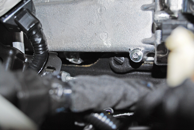 Remove the two clips on the heat shield