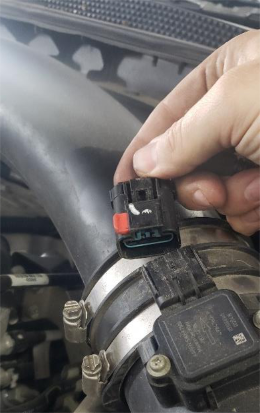 Unplug the MAF connector on the intake hose