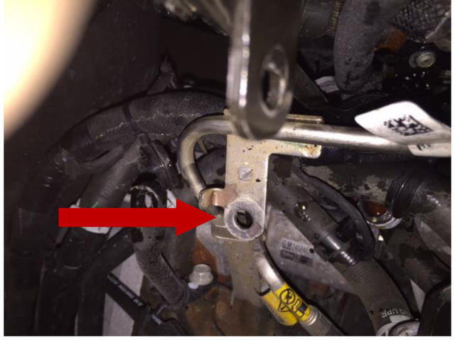 Remove the fuel line support bracket