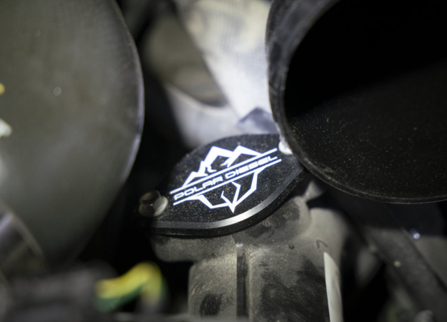 Install the black intake manifold block off plate