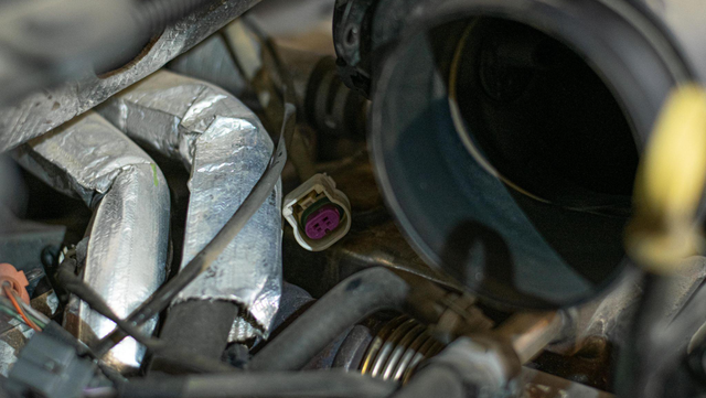 Disconnect the two connectors on the turbo air intake pipe
