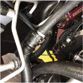 Quick-connect the upper end to the heater core fitting