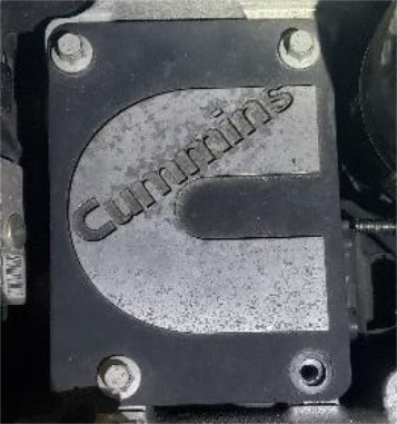 Remove the Cummins emblem from the intake manifold